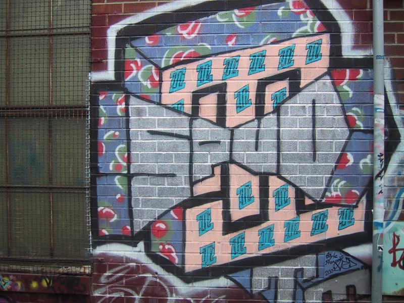 416 Grafitti Expo, Канада: кирпичная стена с трёхмерным брейком и цветочным фоном