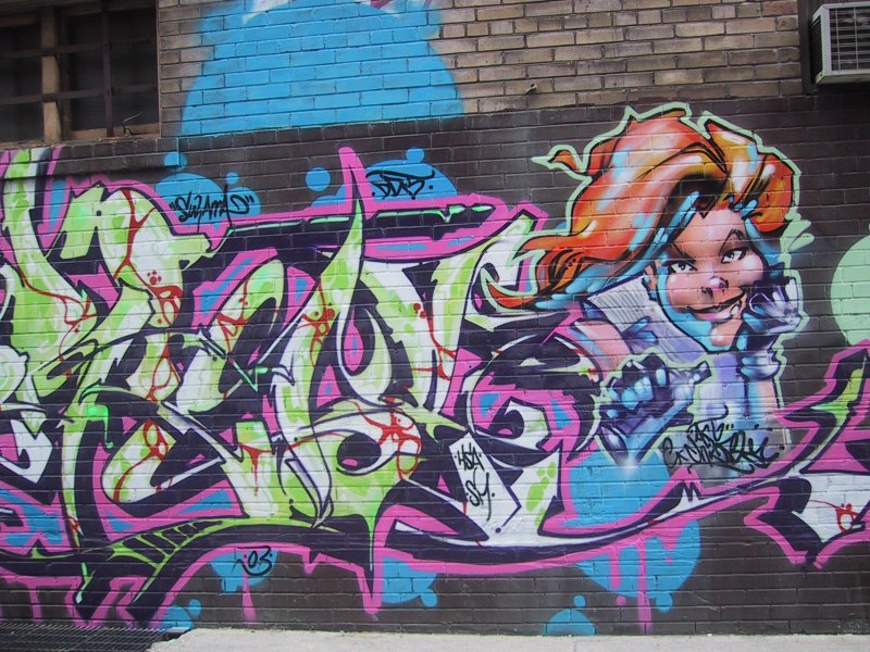 416 Graffiti Expo, Канада: бетонная стена с карикиатурой и ярким граффити-буквами