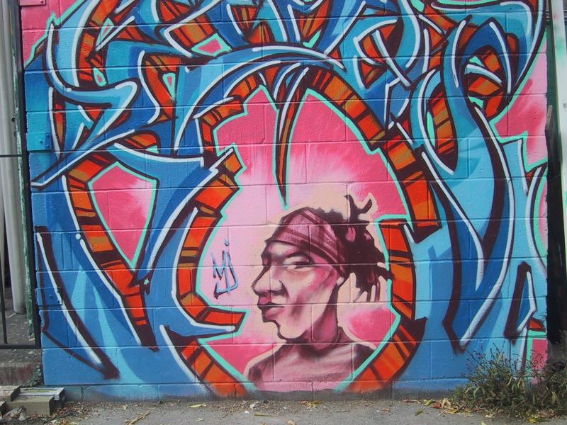 416 Grafitti Expo, Канада: сине-оранжевый граffiti с портретом в центре