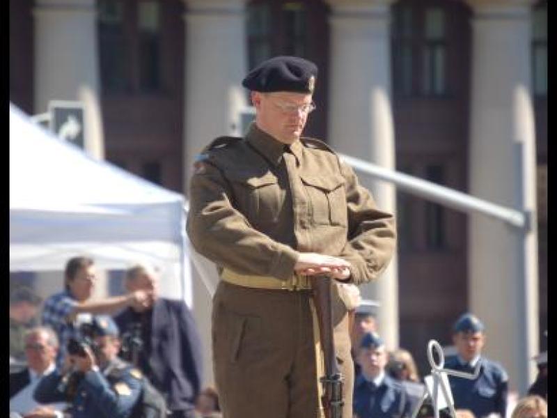 Dieppe Anniversary ceremony in Canada: soldier in 1942 Canadian Army uniform stands at attention