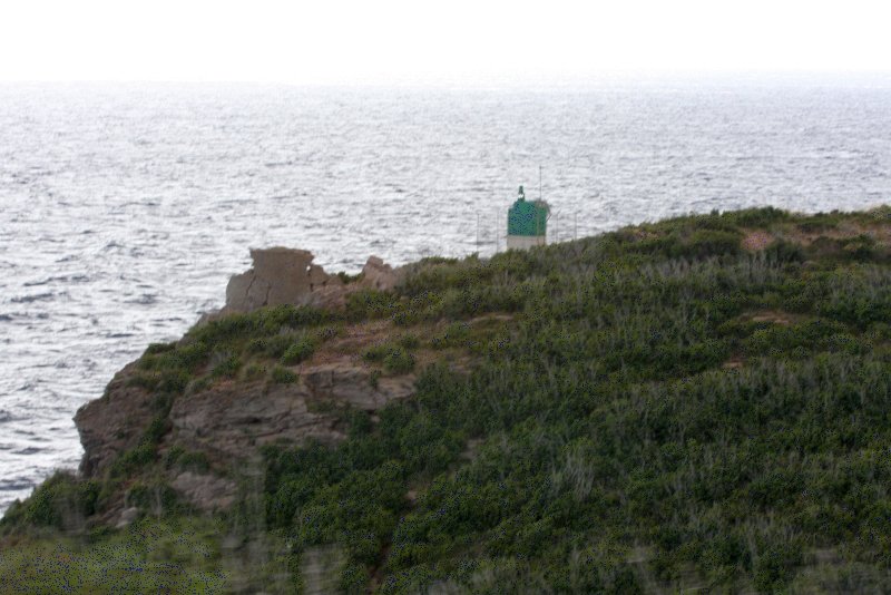 Кап-Корс, Корсика, 2008: зелёный фонарь на скалистом мысе