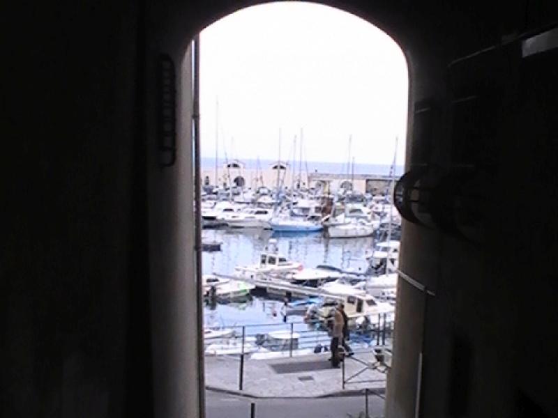 Ajaccio, 2008: арка ведёт к гавани с яхтами и бетонной набережной