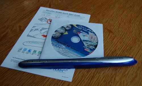 DocuPen RC-806 на деревянном столе с инструкцией и диском