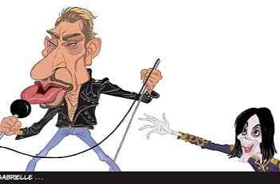 Mate, 2023: карикатура на сцене с микрофоном и вытянутой рукой