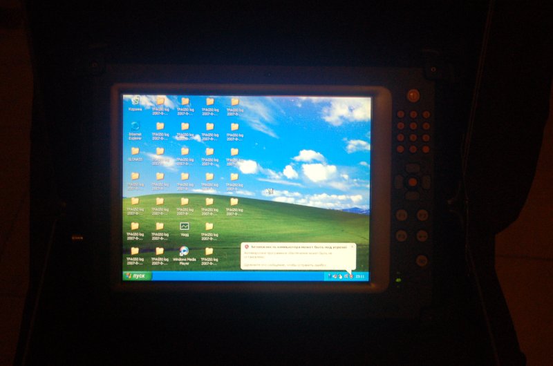 ORSiO TP701: экран с рабочим столом Windows XP и логами TFAGS0