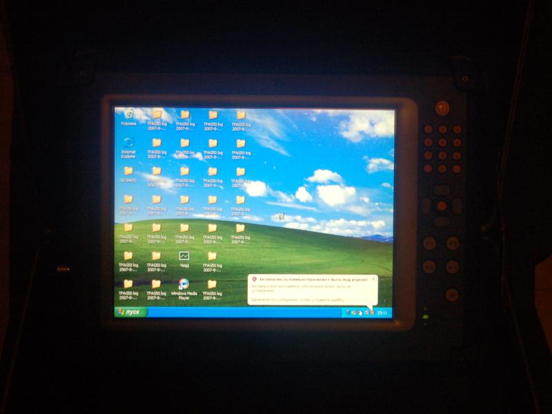 ORSiO TP701: экран с рабочим столом Windows XP и логами TFAGS0