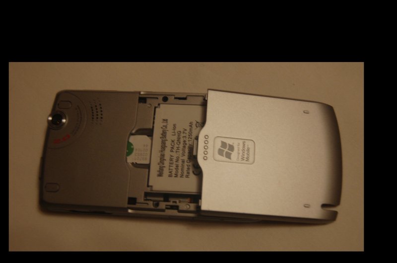 Orsio P745: разборка батарейного отсека с логотипом Windows Mobile
