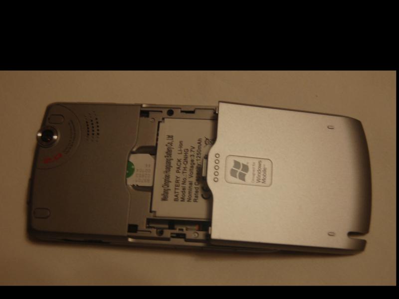 Orsio P745: разборка батарейного отсека с логотипом Windows Mobile