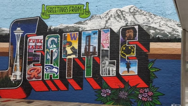 Сиэтл: мурал с видом на Редмонд и Эверест, «Greetings from Seattle»